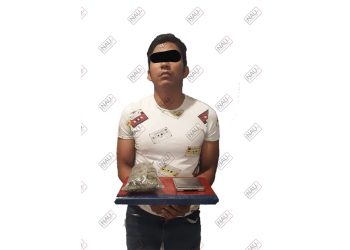 Distribuidor de marihuana fue detenido tras derrapar la motocicleta en que viajaba